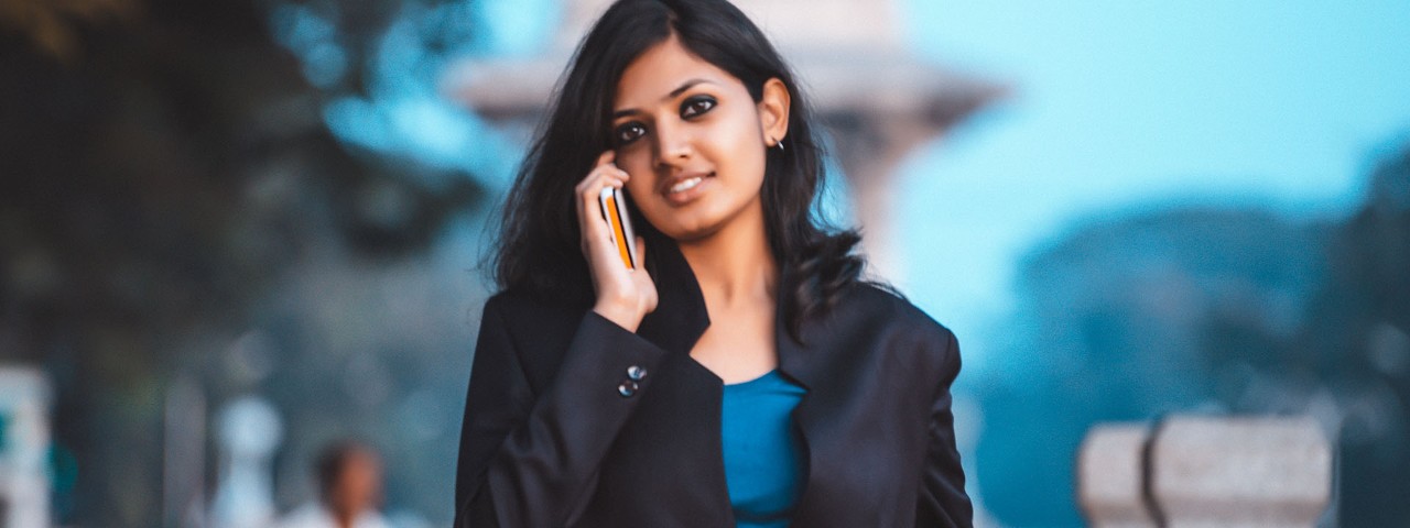 Young business person talking on mobile 