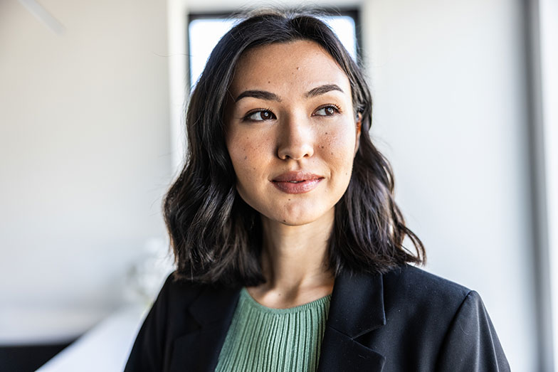 woman looking thoughtful in office