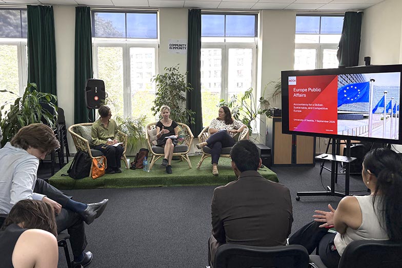 Three speakers in discussion with University of Seattle accounting students during a joint ACCA-EFAA session in Brussels.