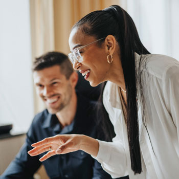 side view of young woman using digital tablet while standing at home side view of young woman using digital tablet while standing at home