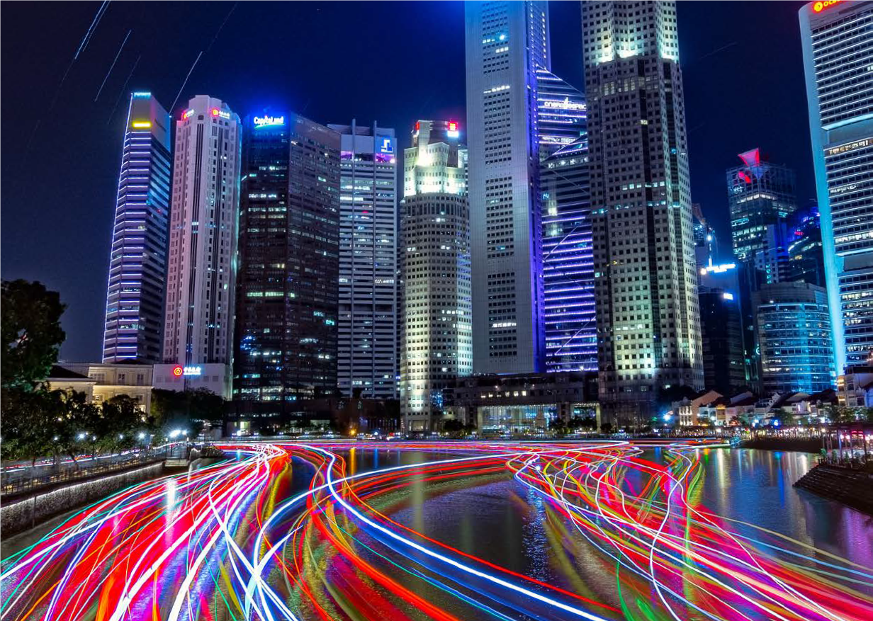 Image of downtown Singapore at night that is on the cover of the report. 