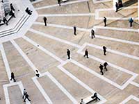 Aerial view of people walking on a hexagonal outdoor paved area