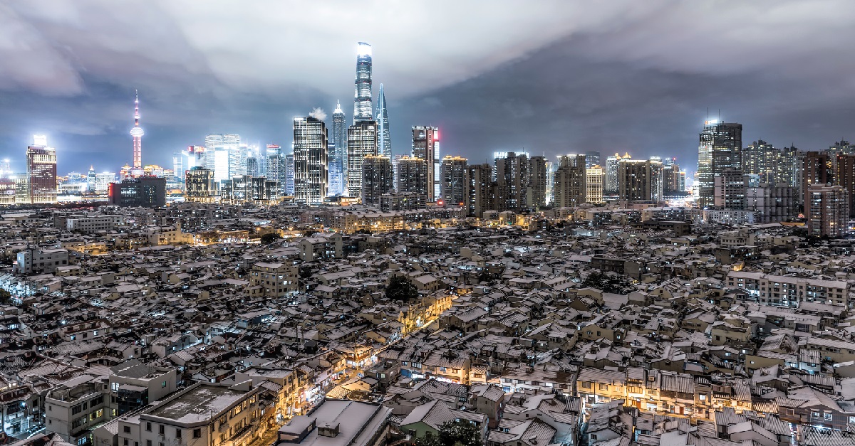 Image of a modern city, showing skyscrapers arranged at the back and low rise building on the foreground which is used on the cover of the report. 