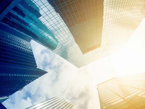  skyscrapers shown as if looking upwards against a blue sky