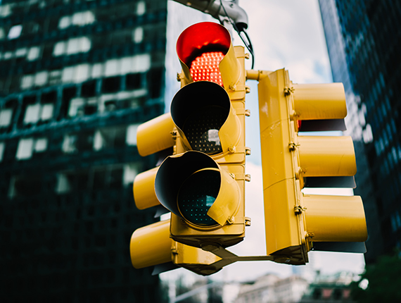 Image of a yellow traffic light on red