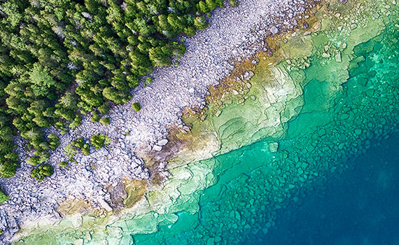 Close up of water flowing into sea