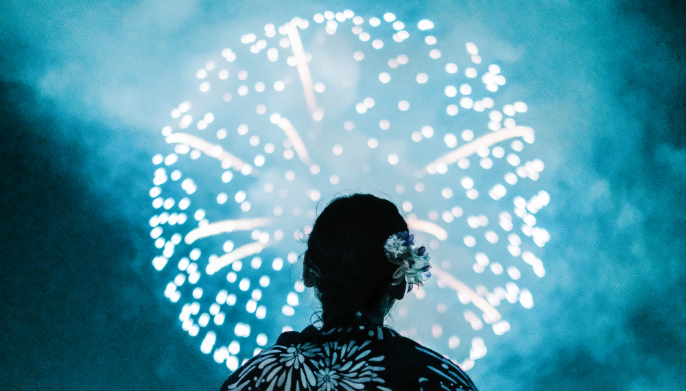 Person watching fireworks Person watching fireworks