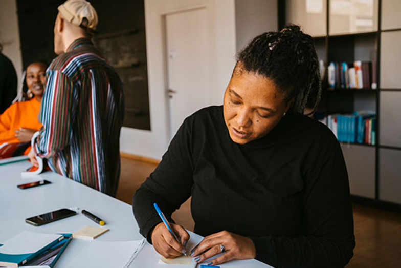 woman working on table in office