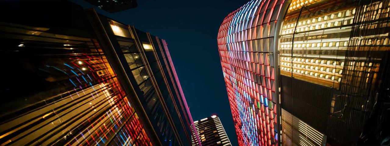 city skyline view looking up from below with lights
