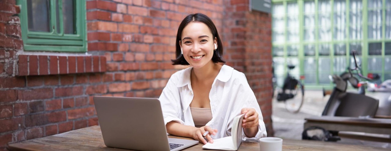 Person smiling looking out of window
