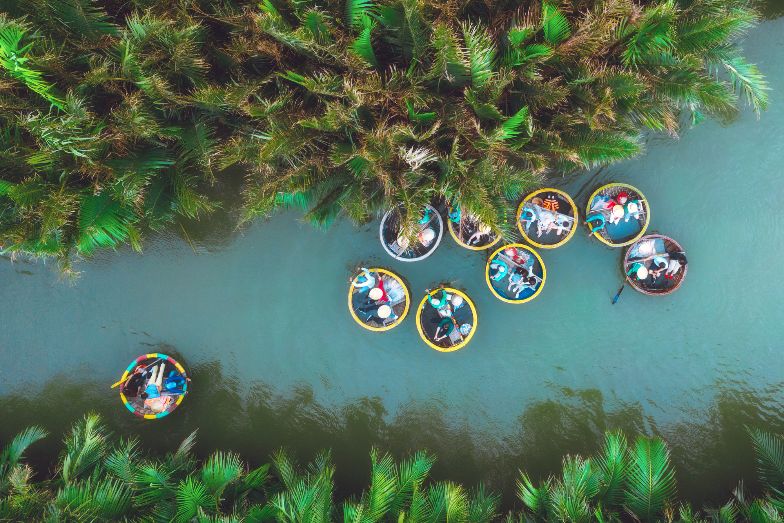 Circular dinghies floating down a tropical river