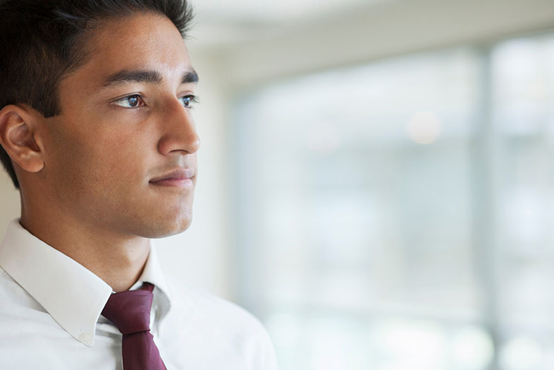 Man staring out window