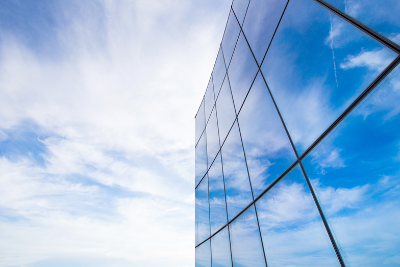 Clouds reflected in building glass