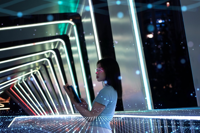 Person holding a tablet in a futuristic building