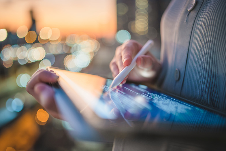 Person using a tablet and stylus pen
