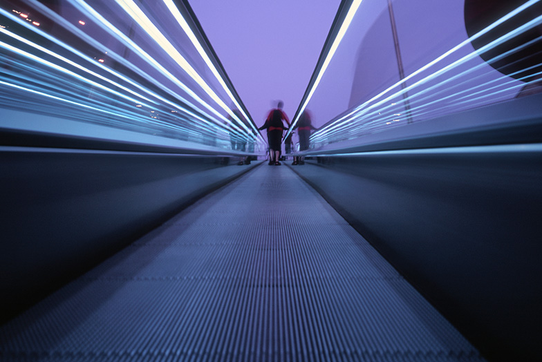 Ground level view of a person on a travelator