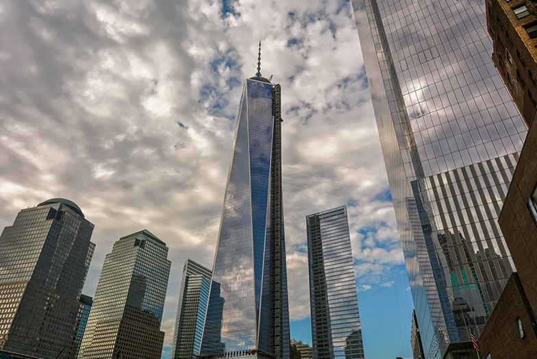 Upwards view of a skyscape against a cloudy sky.