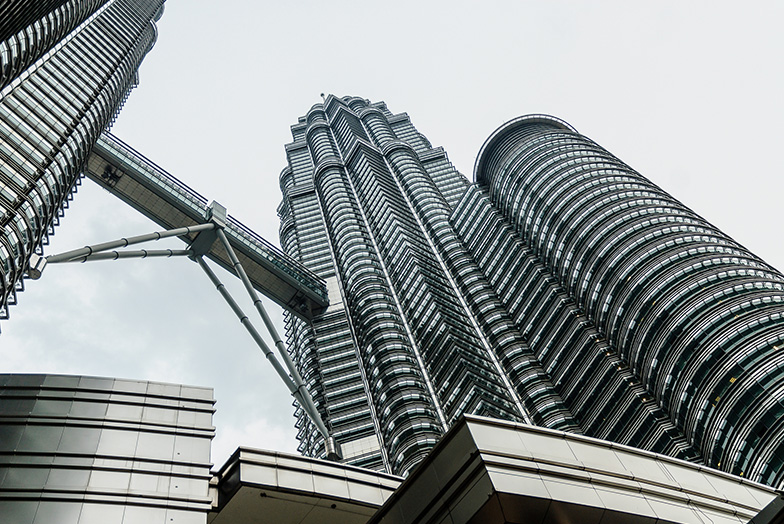 A futuristic skyscraper seen from below