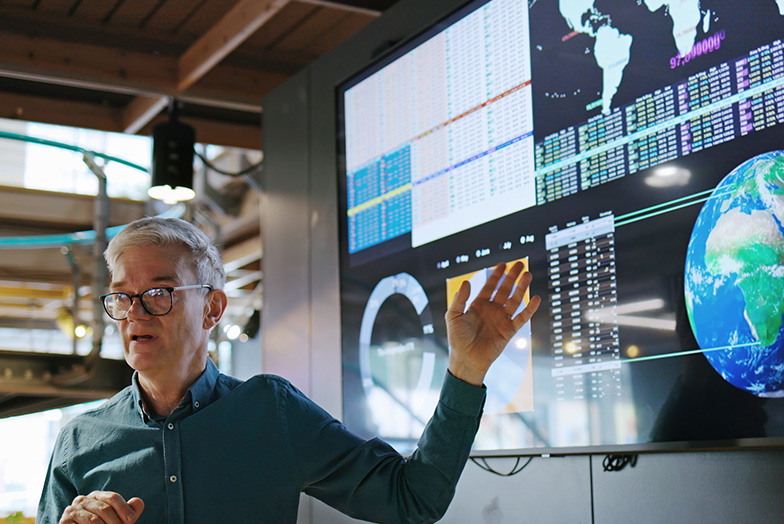 Person explaining about something on a screen