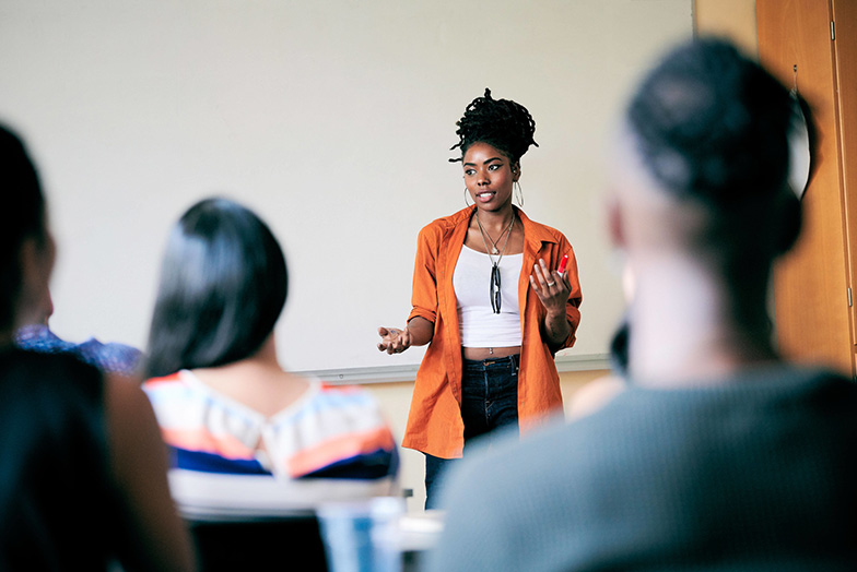 Person presenting to a room of people