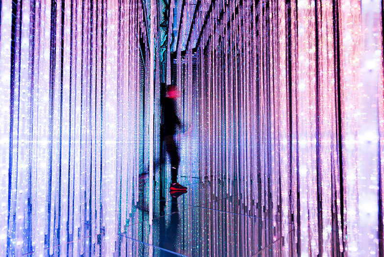 Person walking in shimmering lights