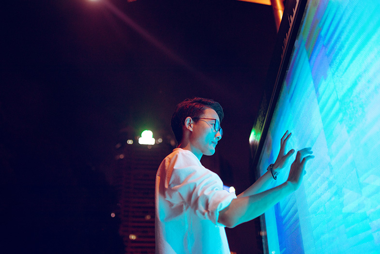 Person touching huge screen