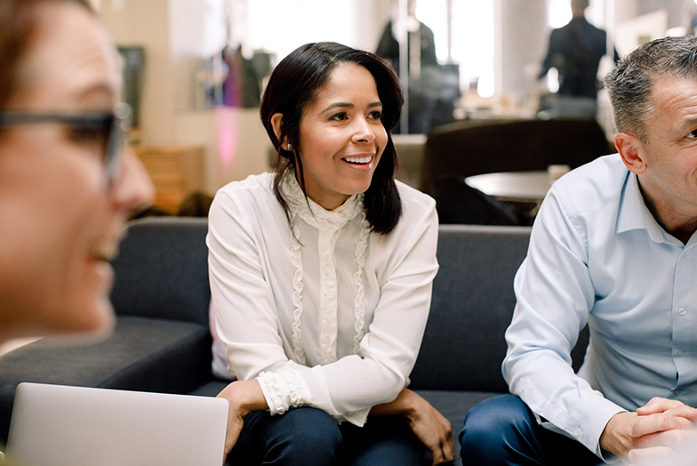 Group of people in office smiling
