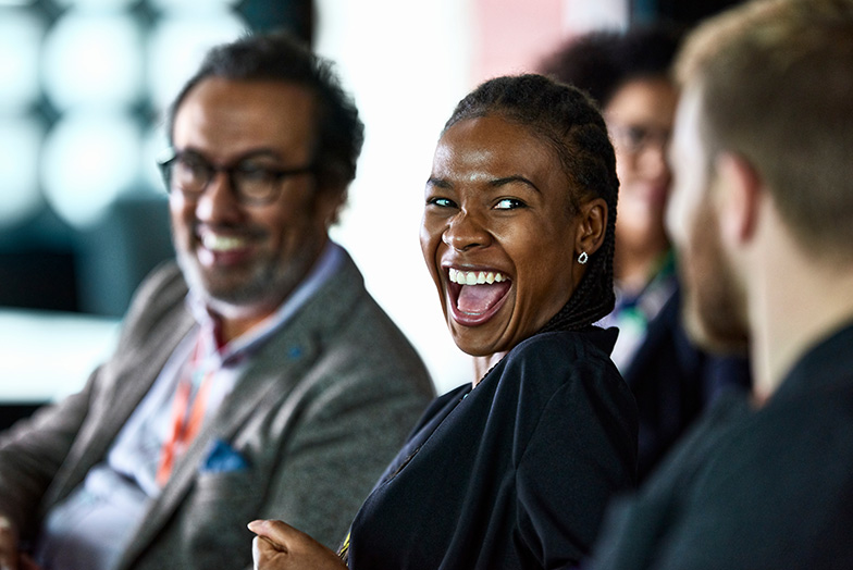 Person laughing in group