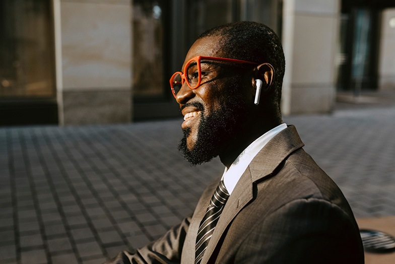 Person with earphones smiling