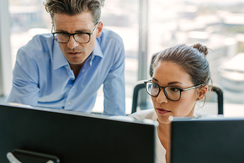 Professionals-looking-at-monitor