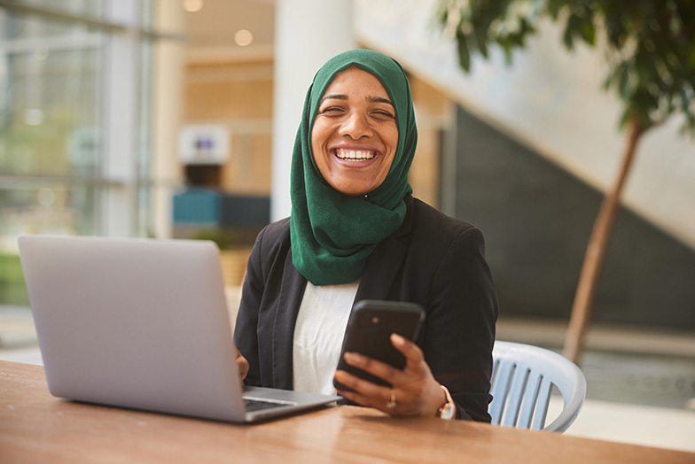 Person in office smiling