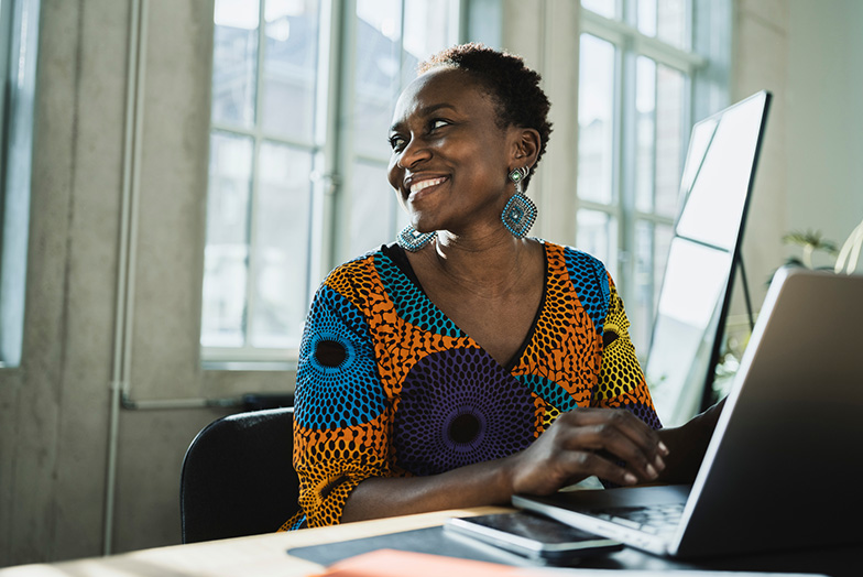 Person on laptop smiling