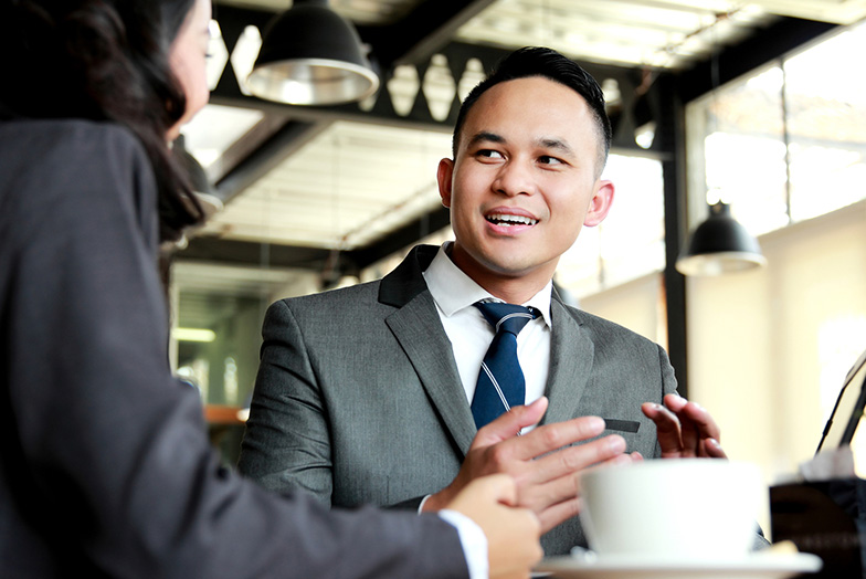 People in office with a cup of tea
