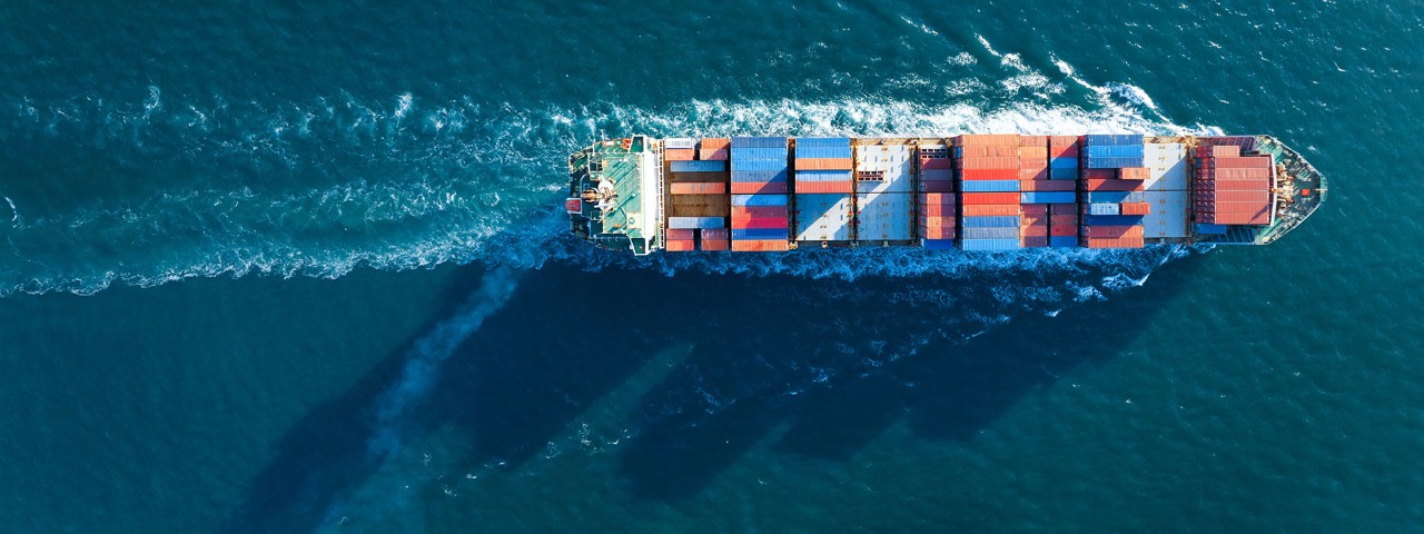 view of cargo ship at sea from above