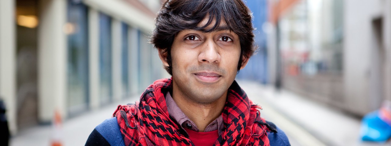 person looking into the camera in an urban setting