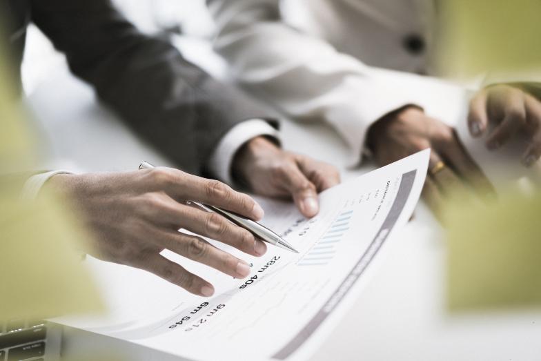 Person reviewing data on a printout