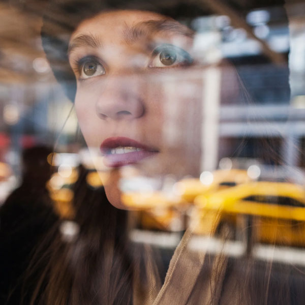 young person looking out of a window