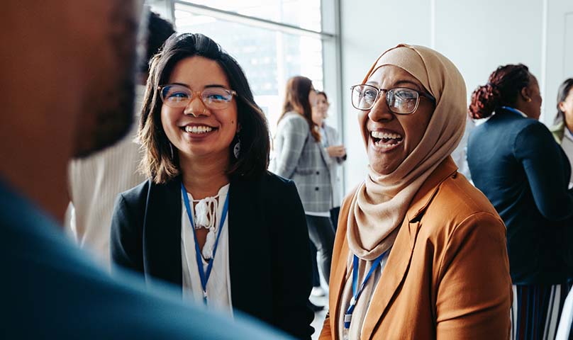 3 people talking and laughing