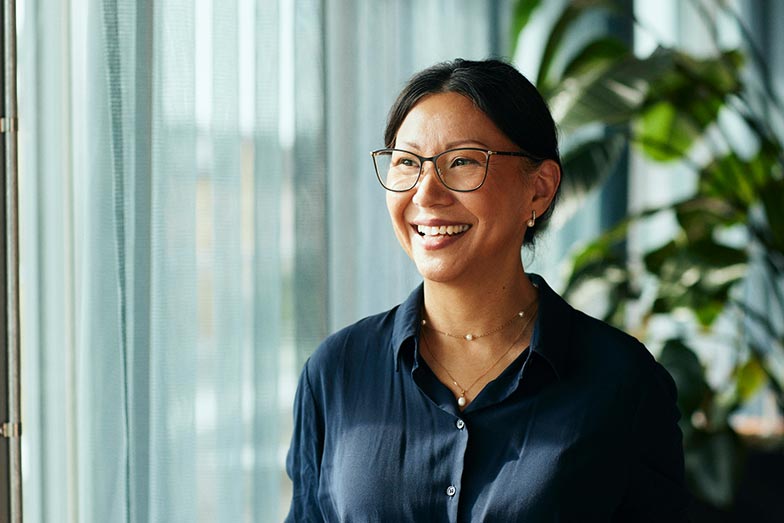 woman in office smiling