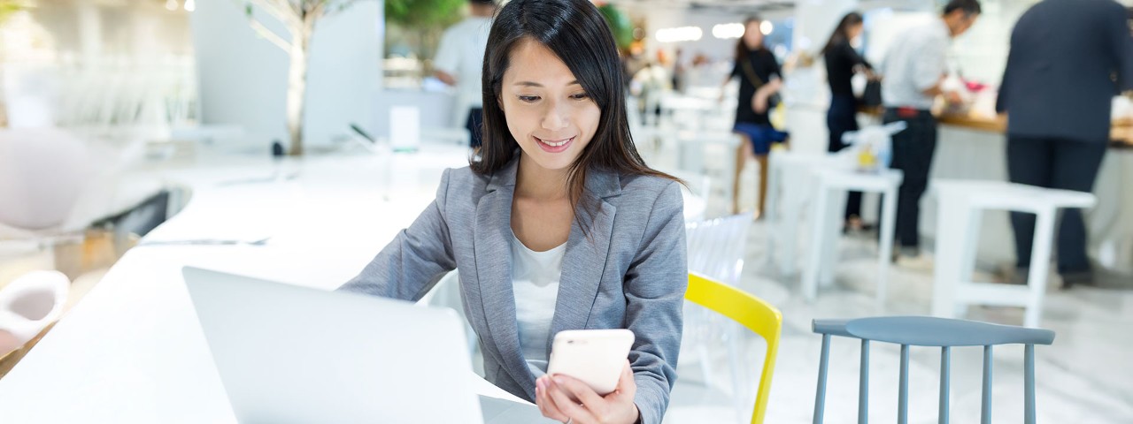 person on phone at table