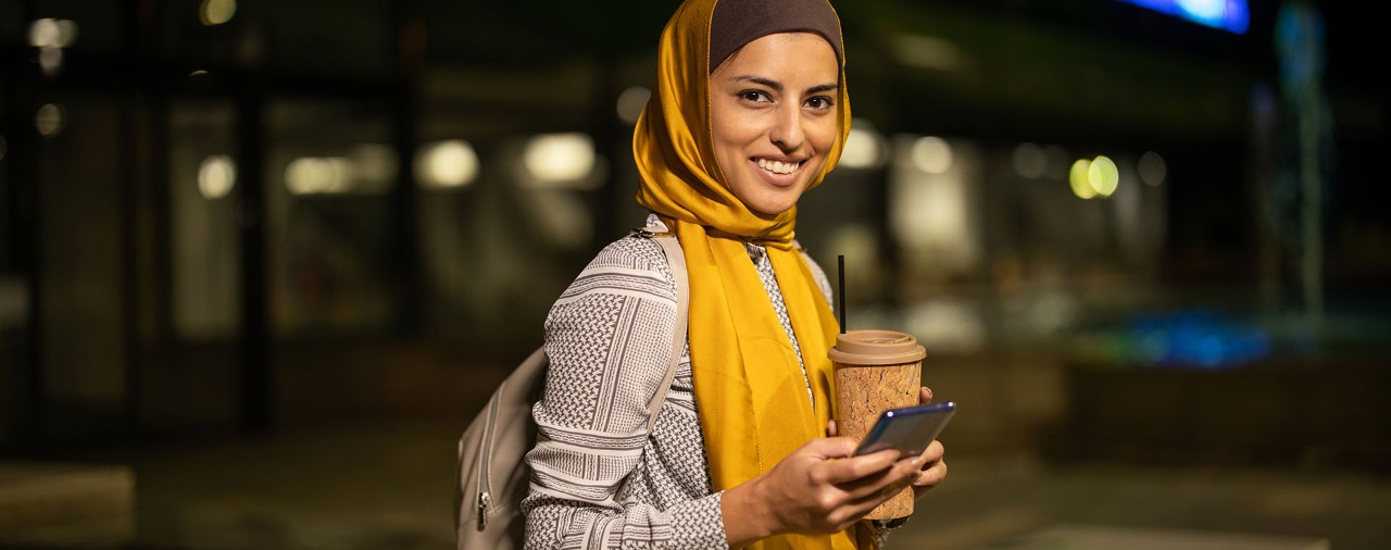 smiling person with coffee