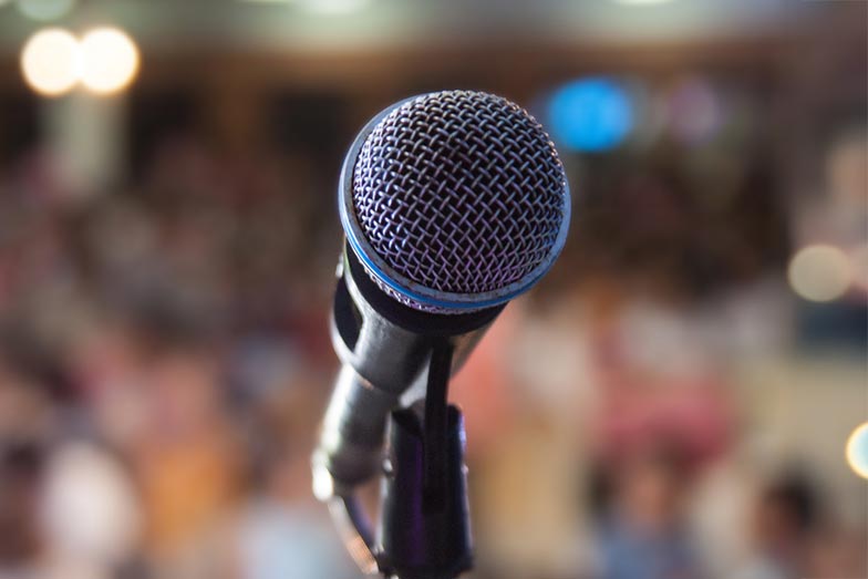 microphone in front of blurry audience