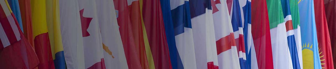person sitting on steps next to railings