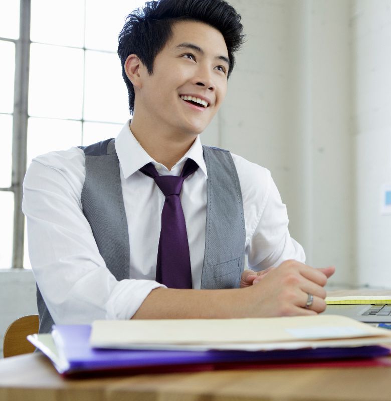 college student smiling upwards