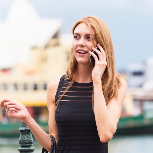 young-professional-talking-on-mobile-outside