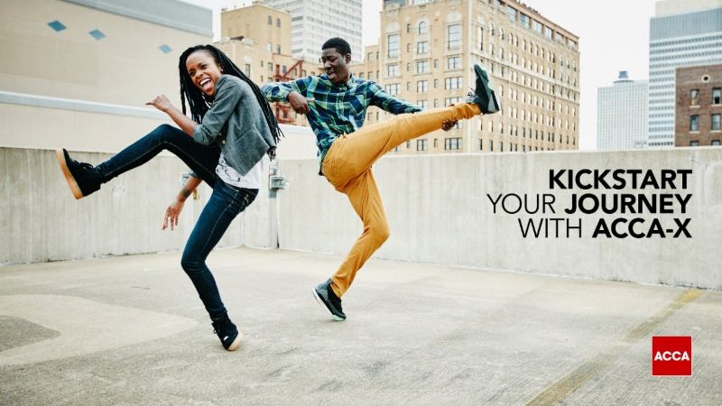 Two happy people dancing on city rooftop