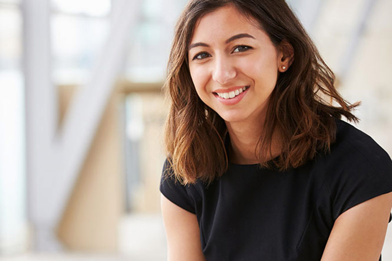 woman smiling and looking at camera